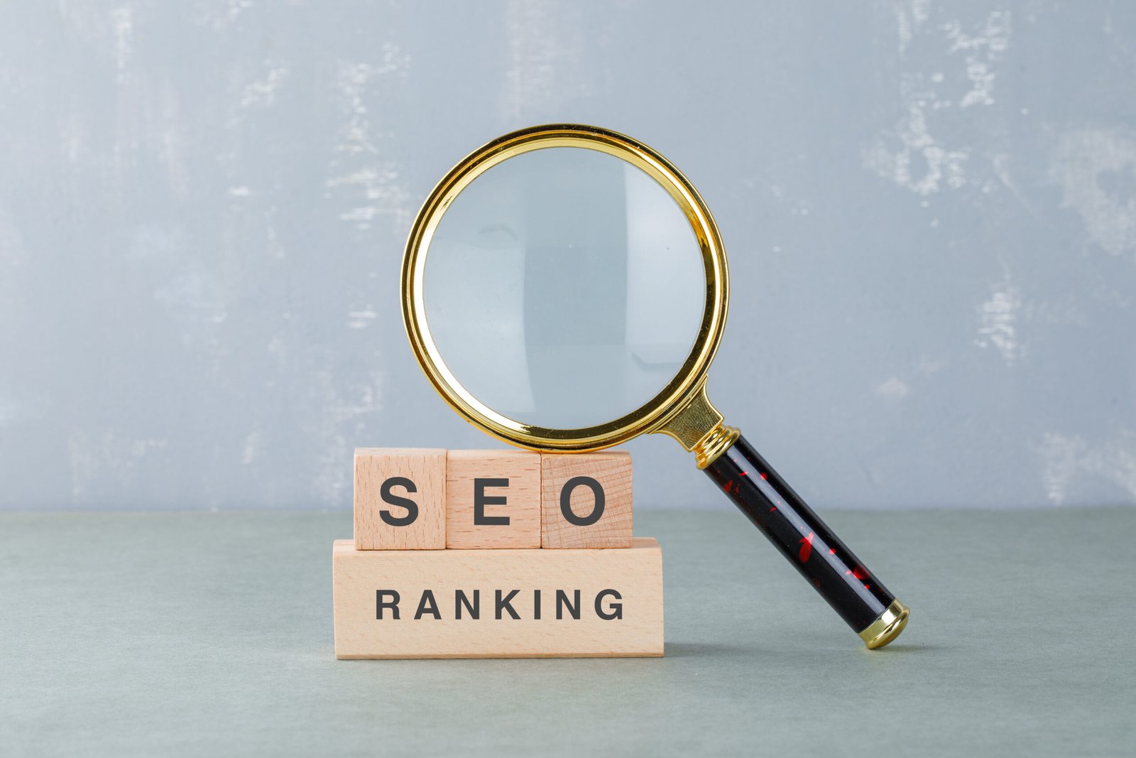 conceptual seo analysis business with wooden blocks with words it magnifying glass side view scaled